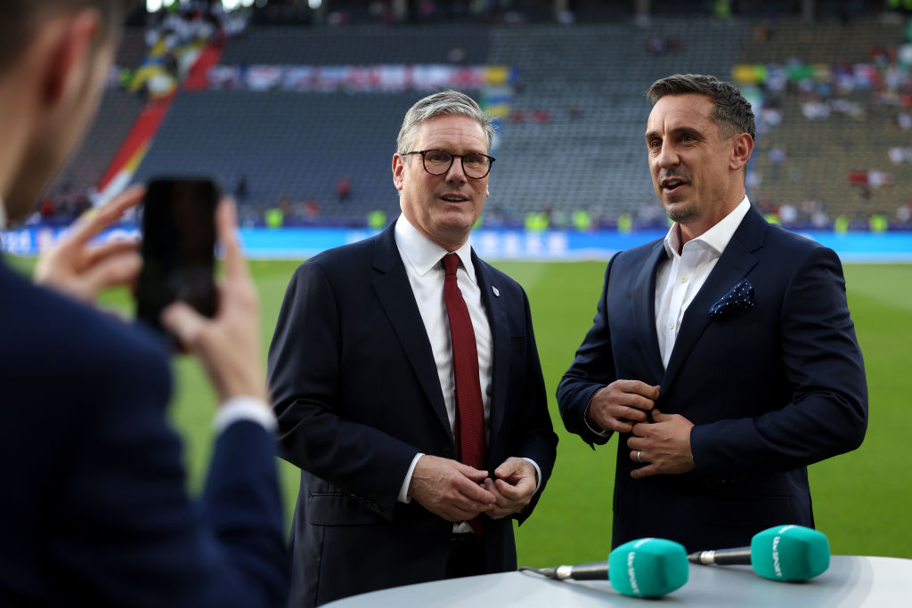 BERLIN, GERMANY - JULY 14: Sir Keir Starmer, Prime Minister of the United Kingdom and Leader of the Labour Party, talks to former England player Gary Neville during the UEFA EURO 2024 final match between Spain and England at Olympiastadion on July 14, 2024 in Berlin, Germany. (Photo by Eddie Keogh - The FA/The FA via Getty Images)